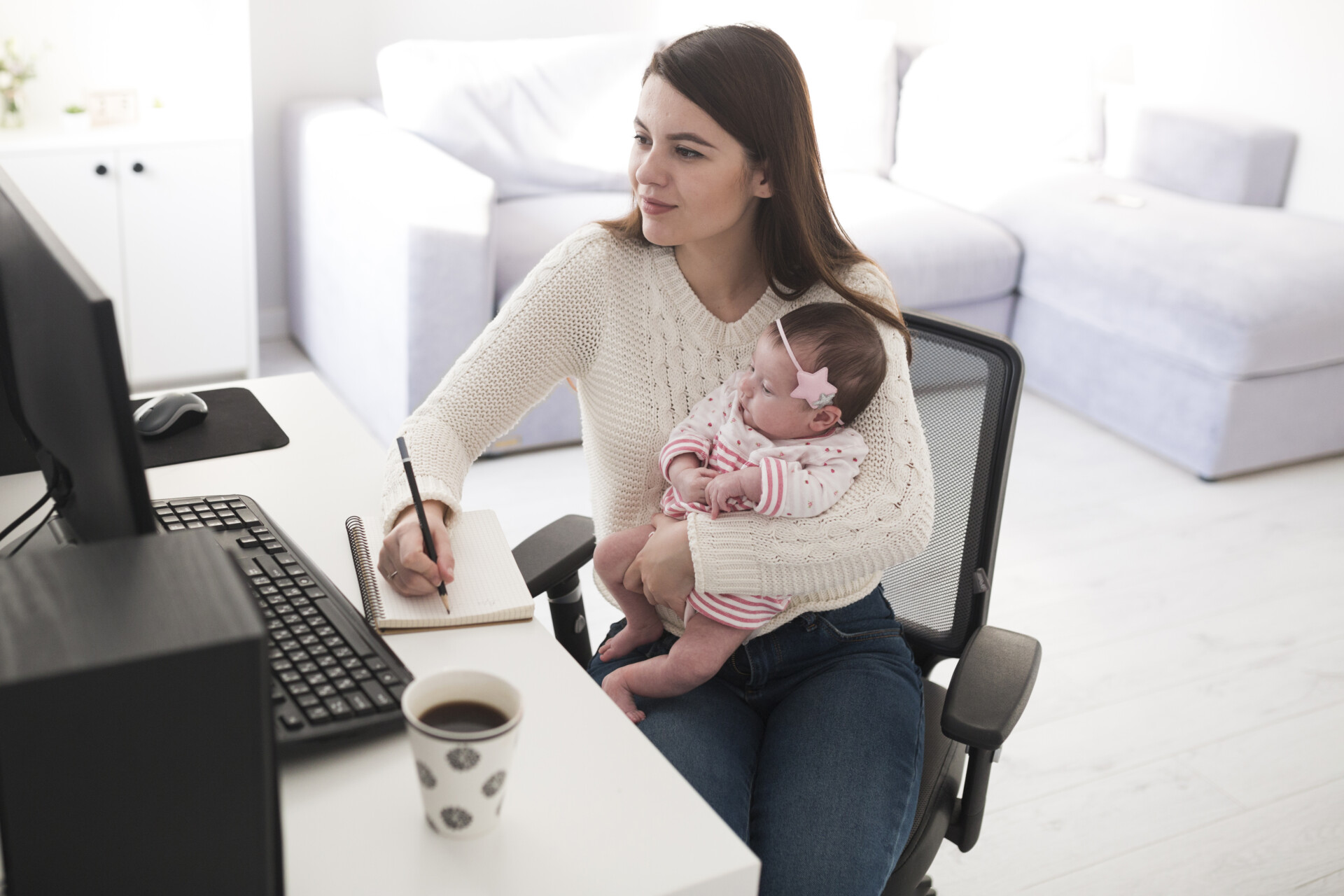 Woman Writing Holding Baby