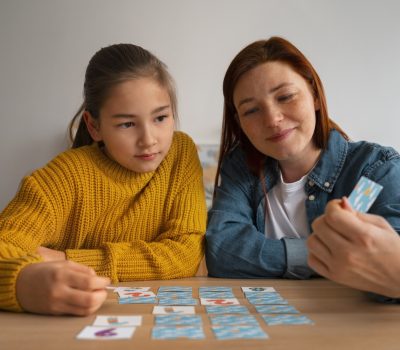 medium-shot-woman-girl-playing-memory-game